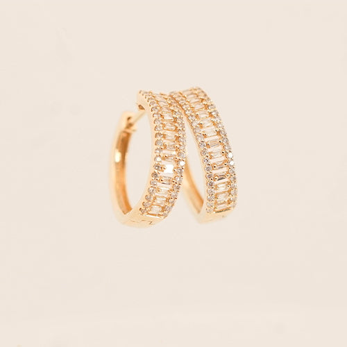 A pair of 14K gold diamond earrings on a white background.